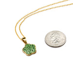 Gold chain with bright green rhinestone flower shaped charm