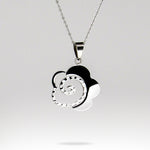 Stainless Steel chain with silver and rhinestone swirl shaped charm